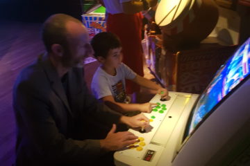 playing vintage arcade game at the tropenmuseum in Amsterdam