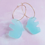 Mint blue acrylic bird pendant hanging on 18K gold plated Golden Creole by Pop-a-porter