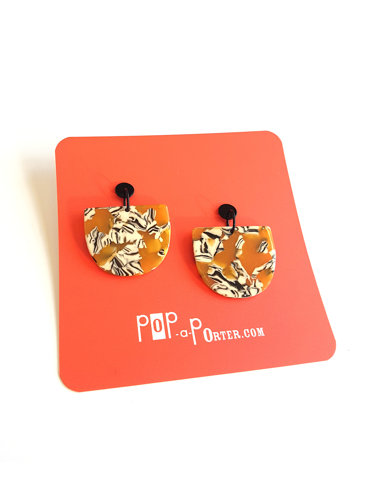 acetate_earrings_ocher_on_card_pin half moon acetate earrings ocher pattern with black ear studs by pop-a-porter