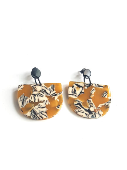 half moon acetate earrings ocher pattern with black ear studs by pop-a-porter