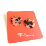 half moon acetate earrings with a tortoise beige pattern set on golden ear studs by pop-a-porter.